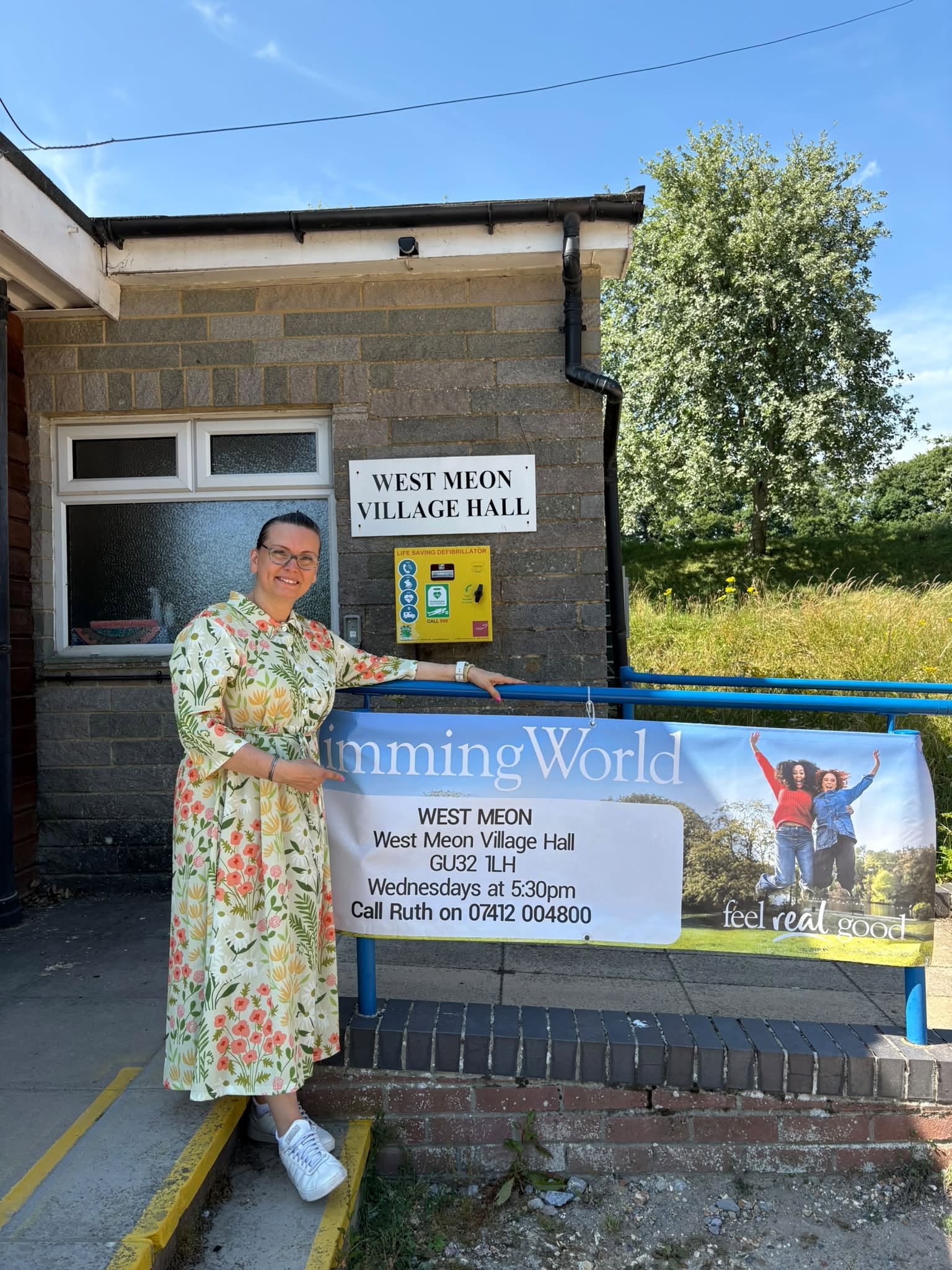 Ruth outside West Meon Village Hall with Slimming World signage